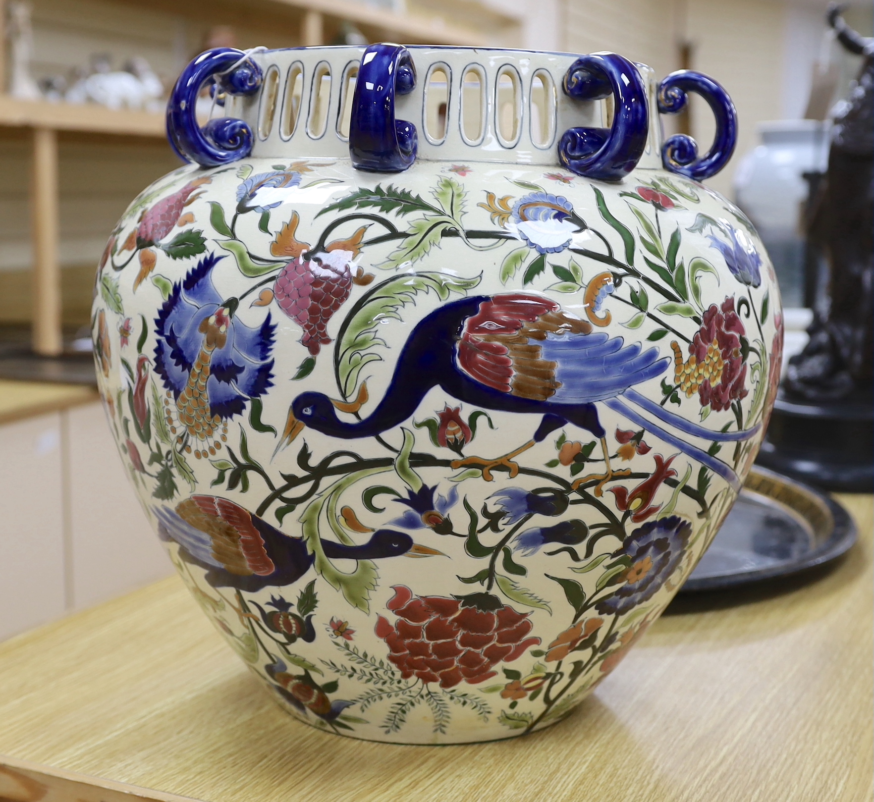A Zsolnay vase with eight handles, pierced rim and floral decoration with birds, a/f, height 39cm